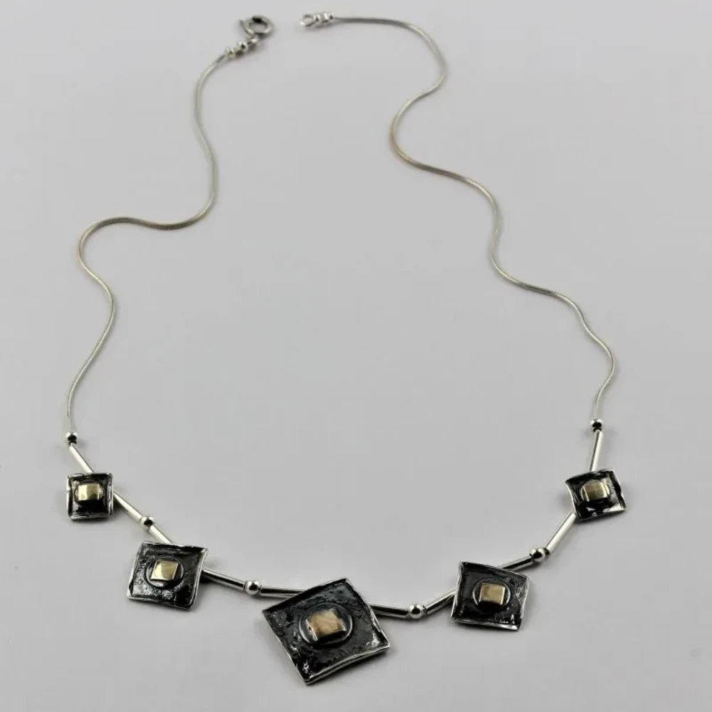 Серебряное колье 925 пробы с золотой отделкой